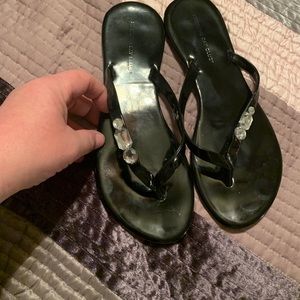 Black flat flip flops